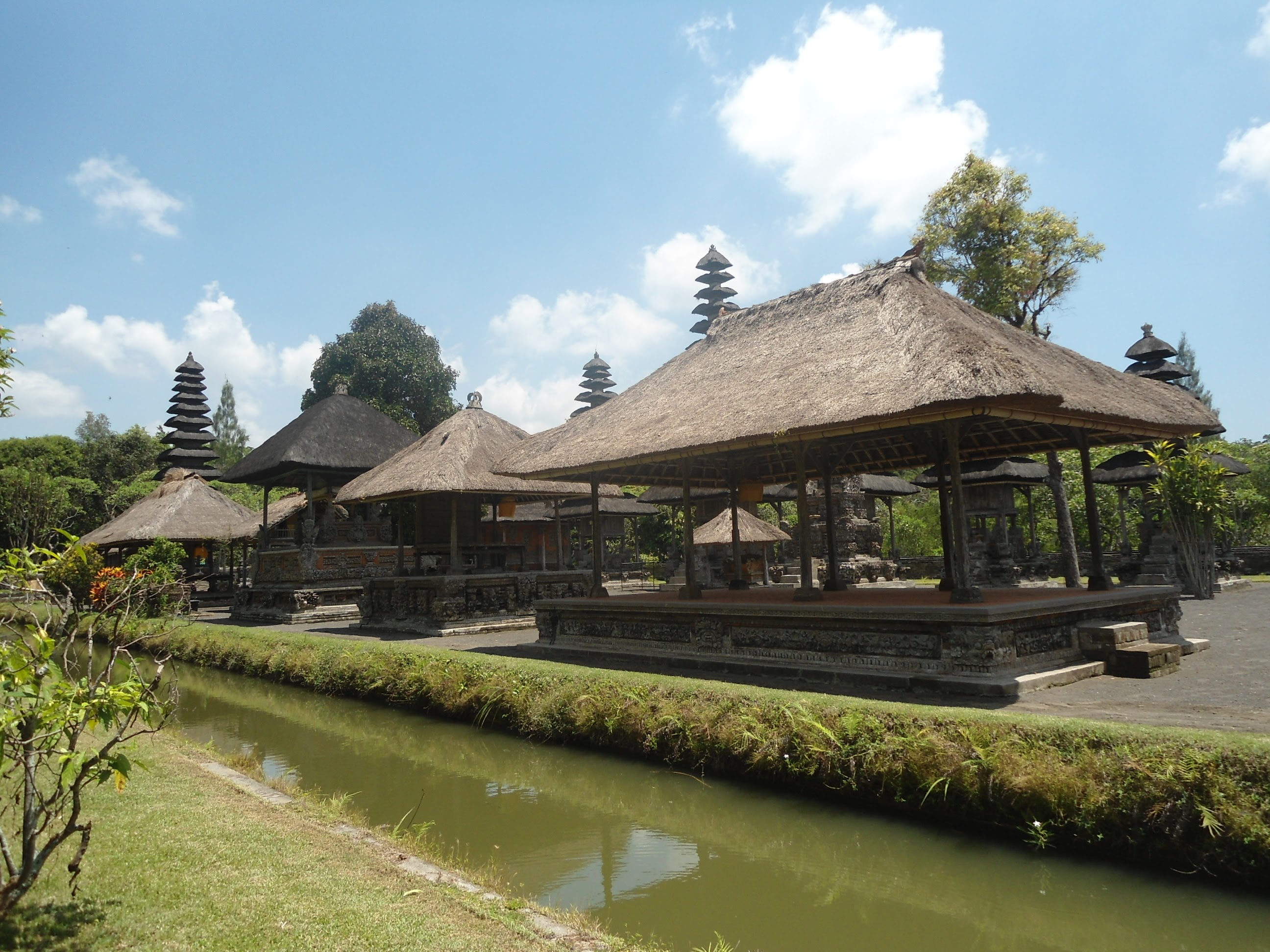 Multi-tiered meru shrines of Pura Taman Ayun rising above a moat in Mengwi