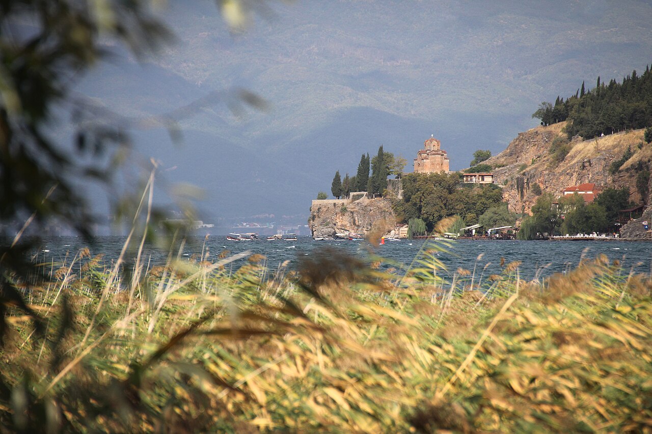 Panoramic view of Lake Ohrid with mountains reflected in still water