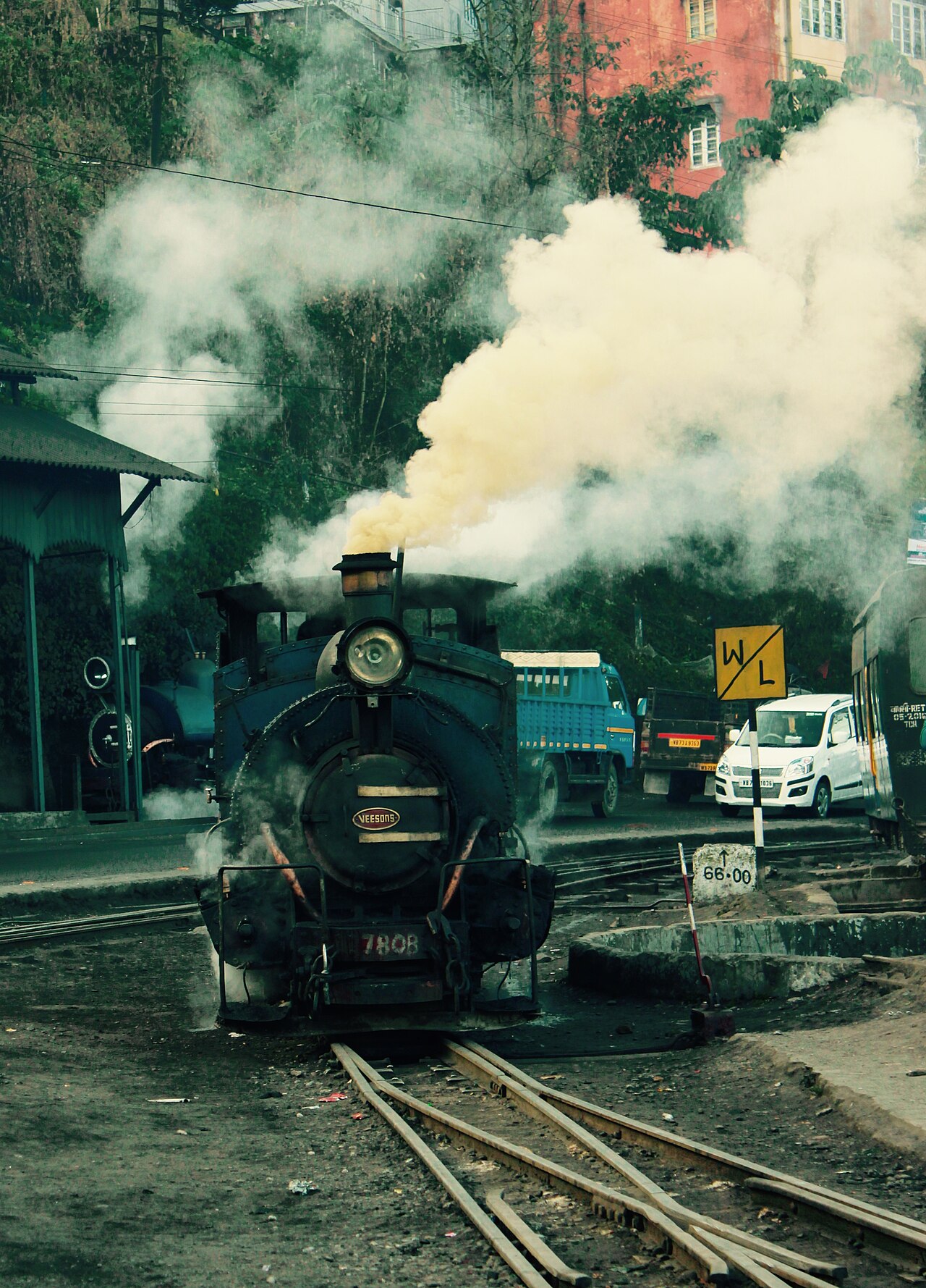 Darjeeling Himalayan Railway narrow-gauge train on a street-level track in Darjeeling town