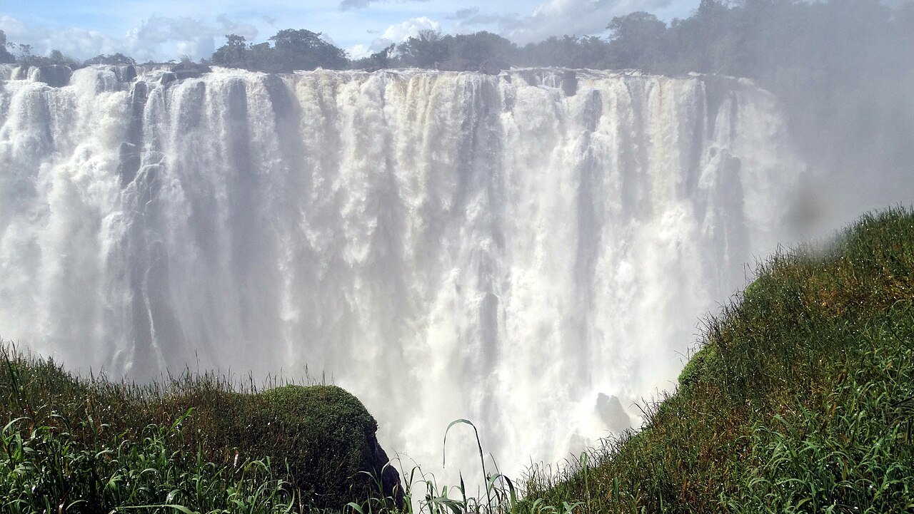 Victoria Falls wide curtain of white water seen from the Zambian side