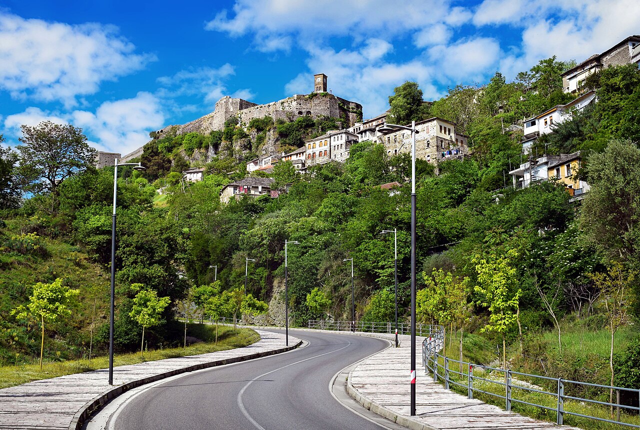 Gjirokastra fortress rising above the Ottoman stone tower houses of the historic centre