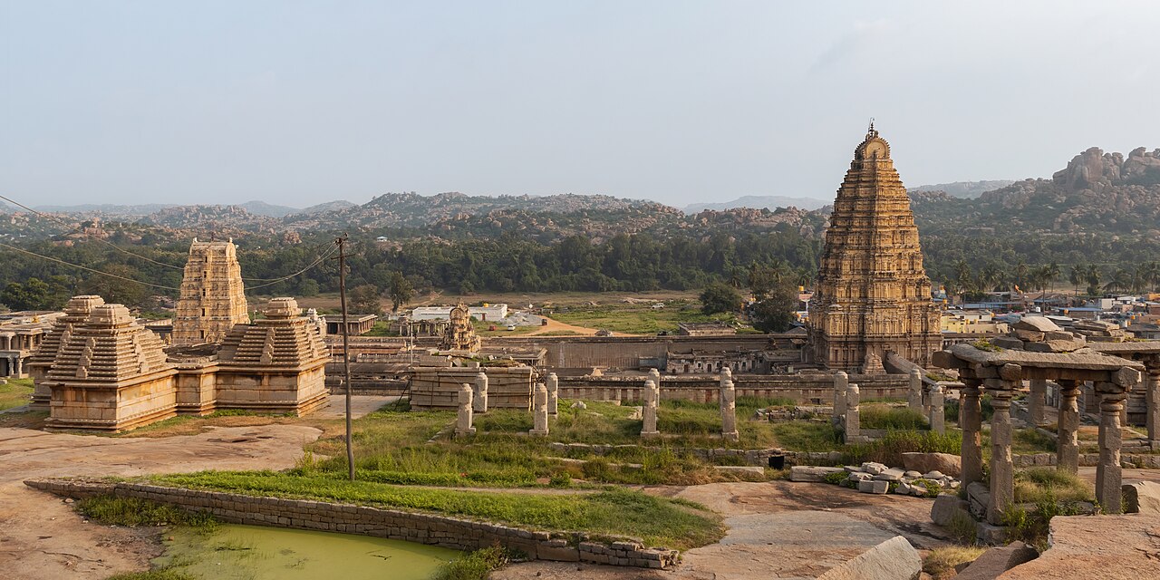 The 49-metre gopuram (temple tower) of the Virupaksha Temple in Hampi rising above the temple complex, the oldest functioning Hindu temple in the former Vijayanagara Empire capital