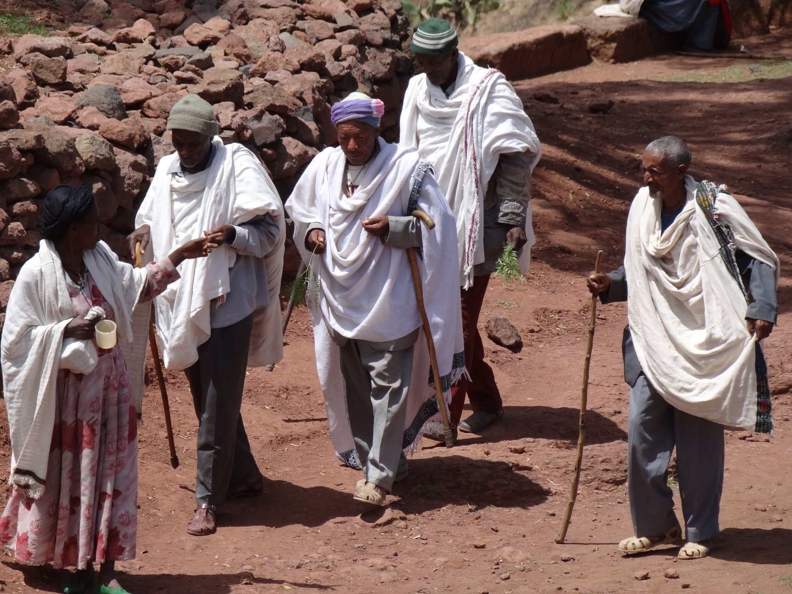 Orthodox Christian worshippers in white robes at the entrance to Bet Giyorgis church, Lalibela