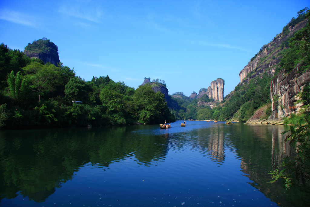 Sea of clouds over the Wuyi Mountains in Fujian, China — the UNESCO-listed natural and cultural landscape with Nine Bend River and Neolithic boat coffins on cliff ledges