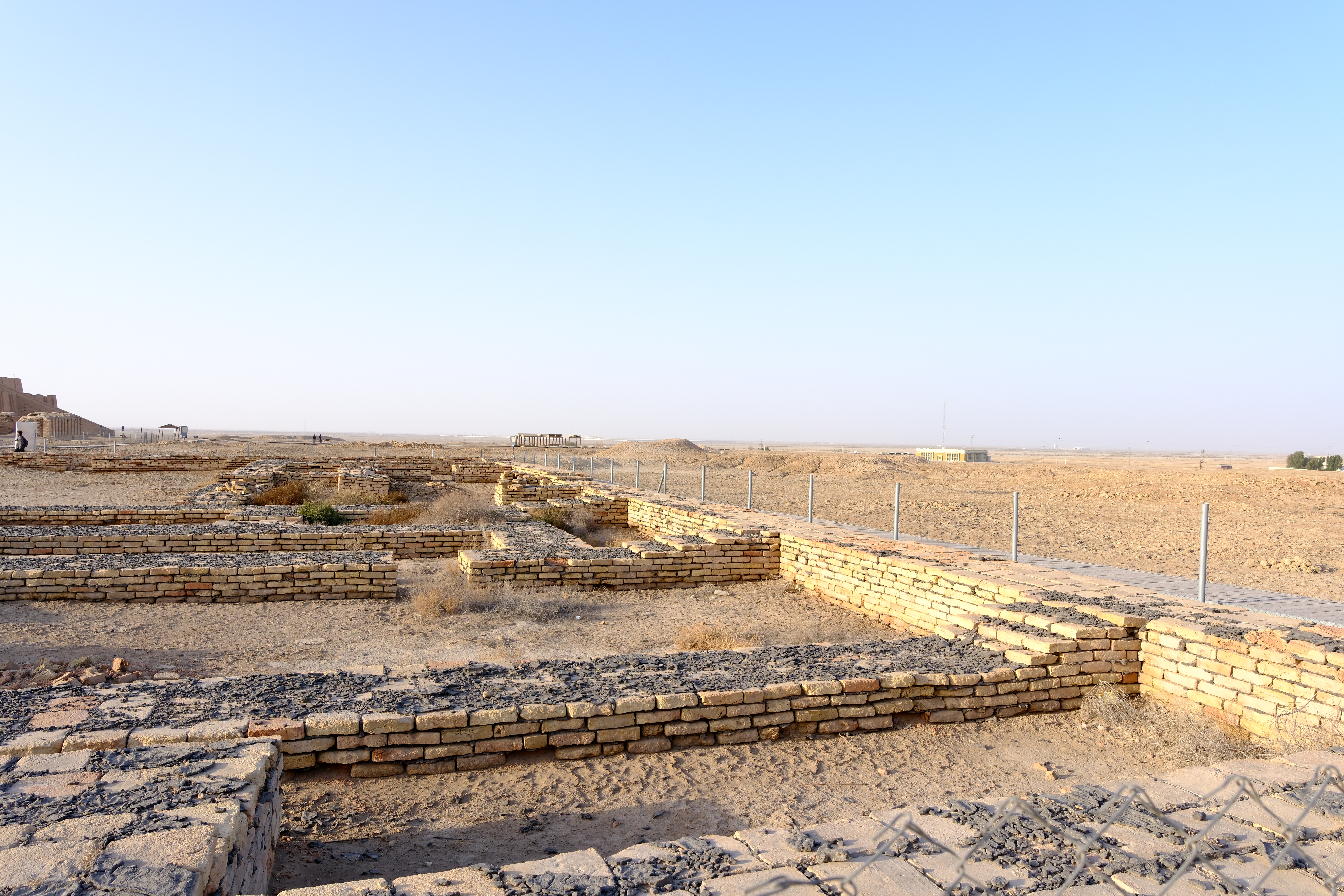 Ziggurat of Ur with massive mud-brick terraces rising against a blue sky