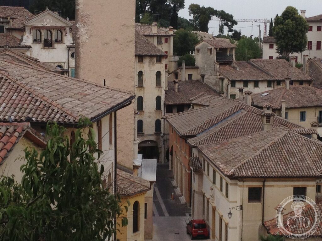 Rooftops, towers and a narrow street of Asolo seen from above