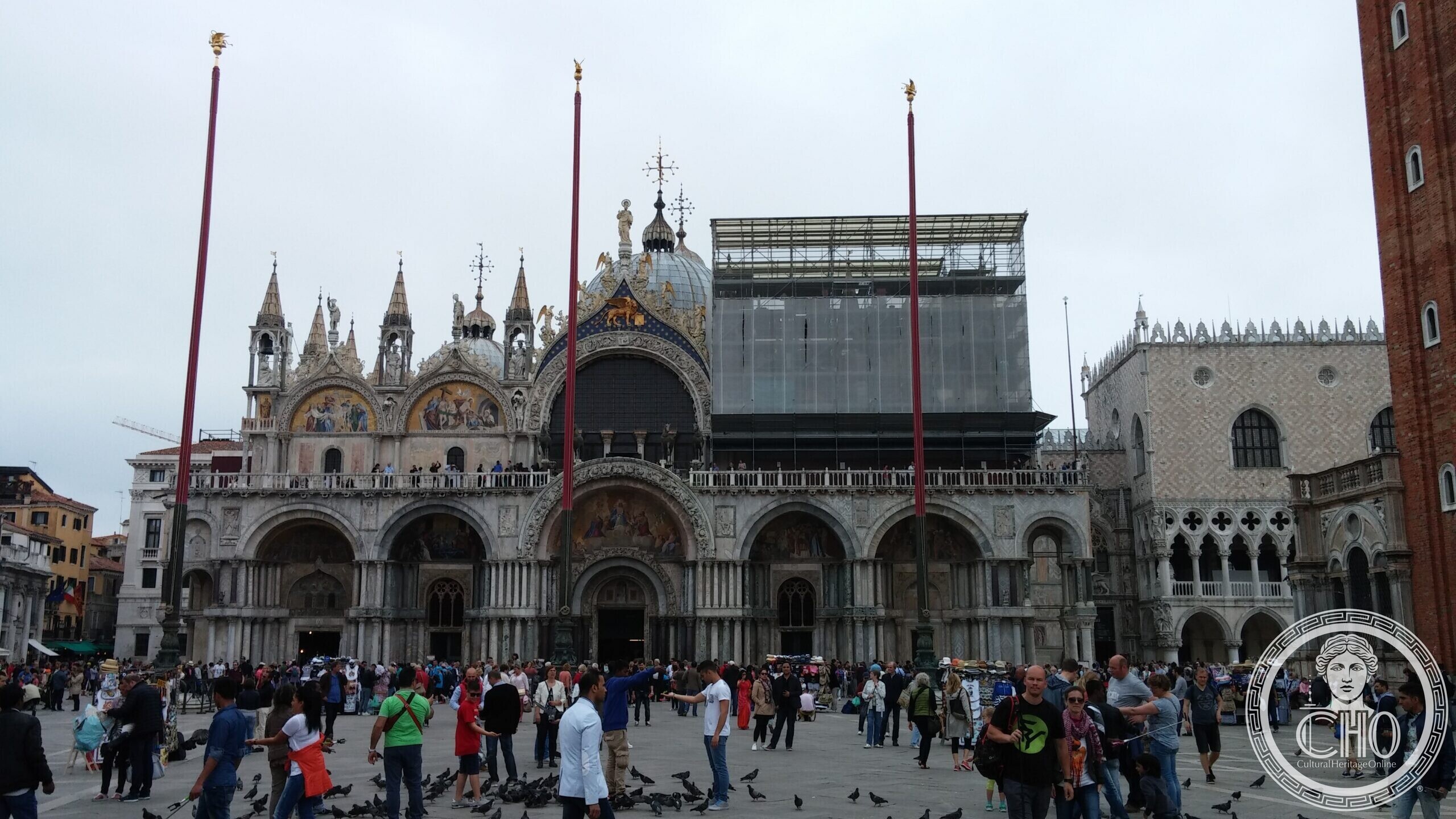 The basilica of San Marco seen from Piazza San Marco, with the three flagpoles and part of the Doge's Palace