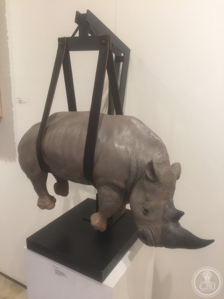 Sculpture of a rhinoceros suspended in a lifting harness, on display at Bel-Air Fine Art, San Marco I, Venice