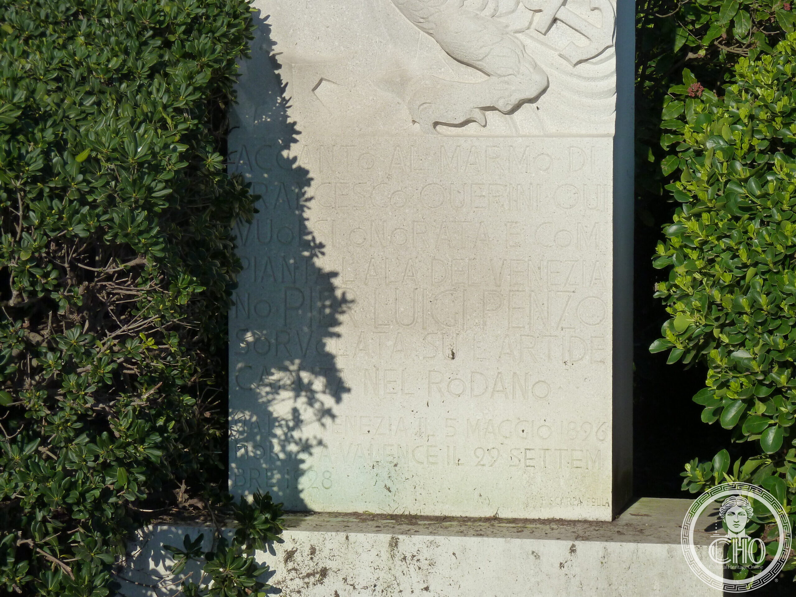 Stone monument with an eagle relief to aviator Pier Luigi Penzo in the Giardini di Castello, Venice