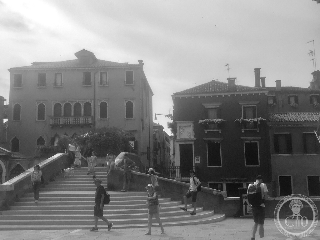 Ponte del Cavallo arching over Rio dei Mendicanti with gondolas and historical canal houses from Campo Santi Giovanni e Paolo