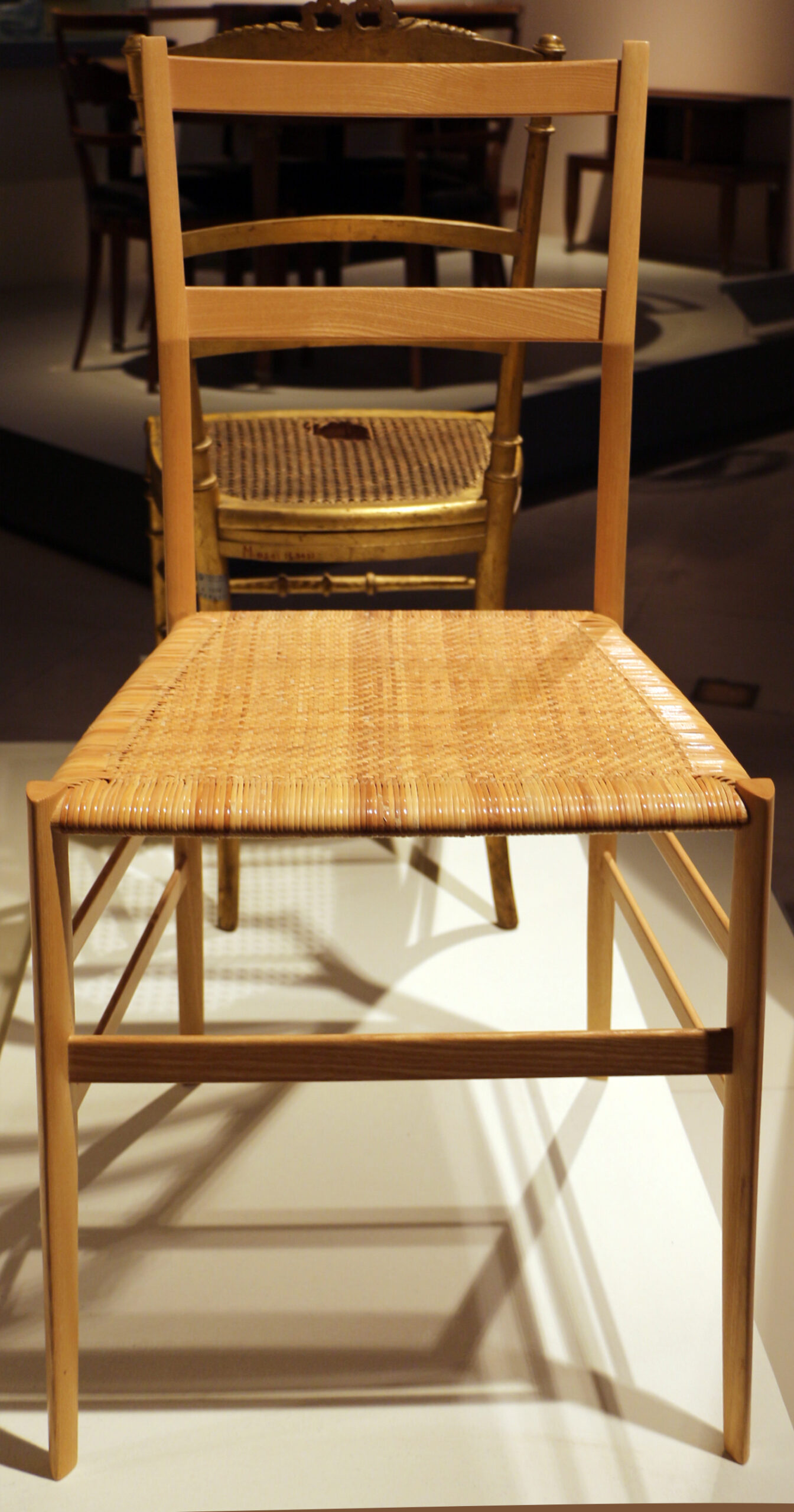 The minimalist wooden 699 Superleggera chair designed by Gio Ponti and crafted by Cassina