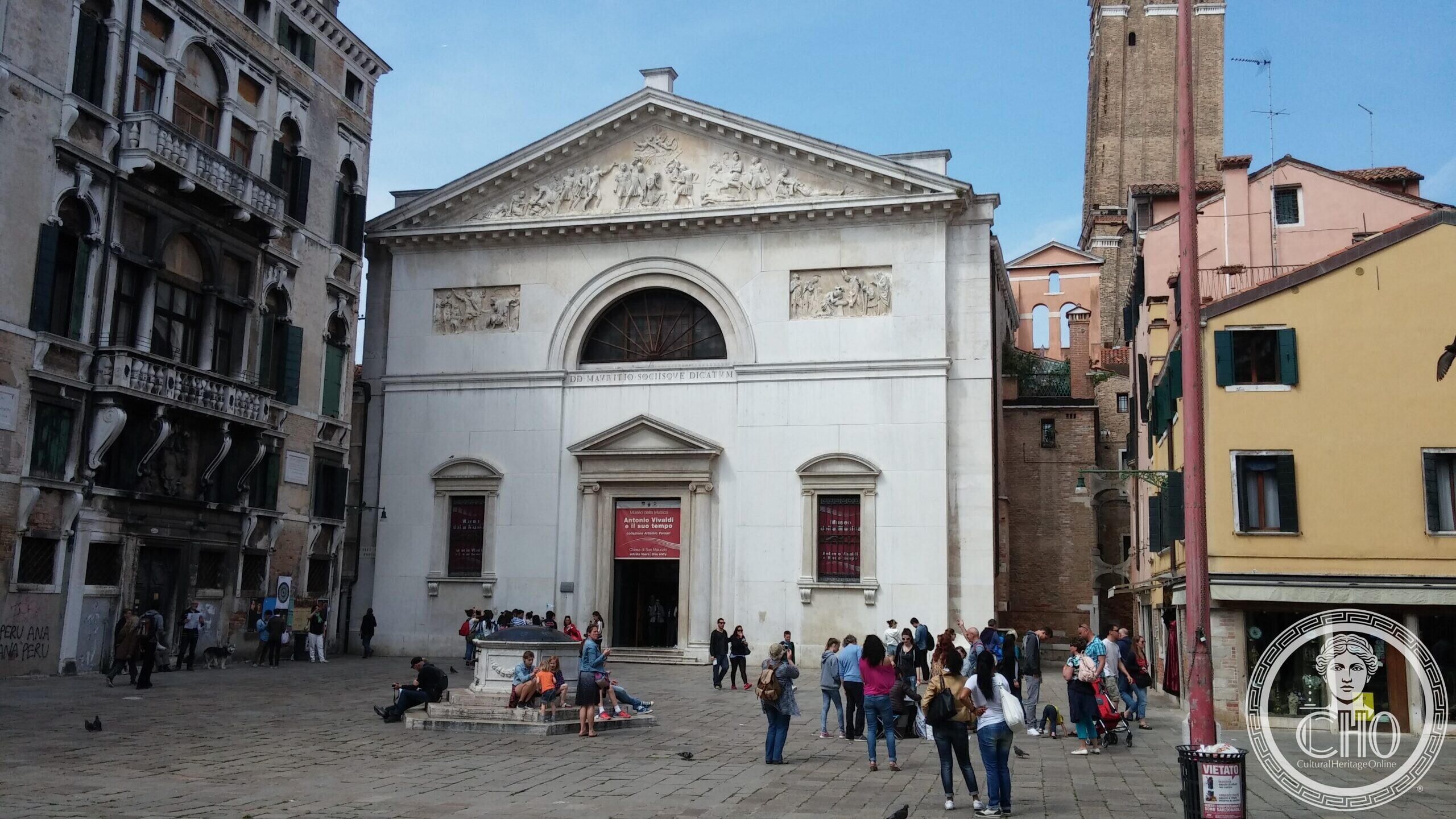 The neoclassical facade of the former church of San Maurizio in Venice, with its sculpted pediment and the inscription above the window