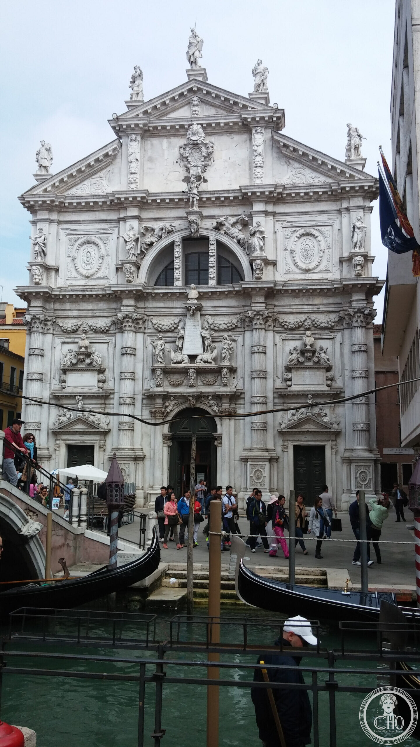 The heavily sculpted Baroque facade of the church of San Moise in Venice, seen from the bridge over the canal
