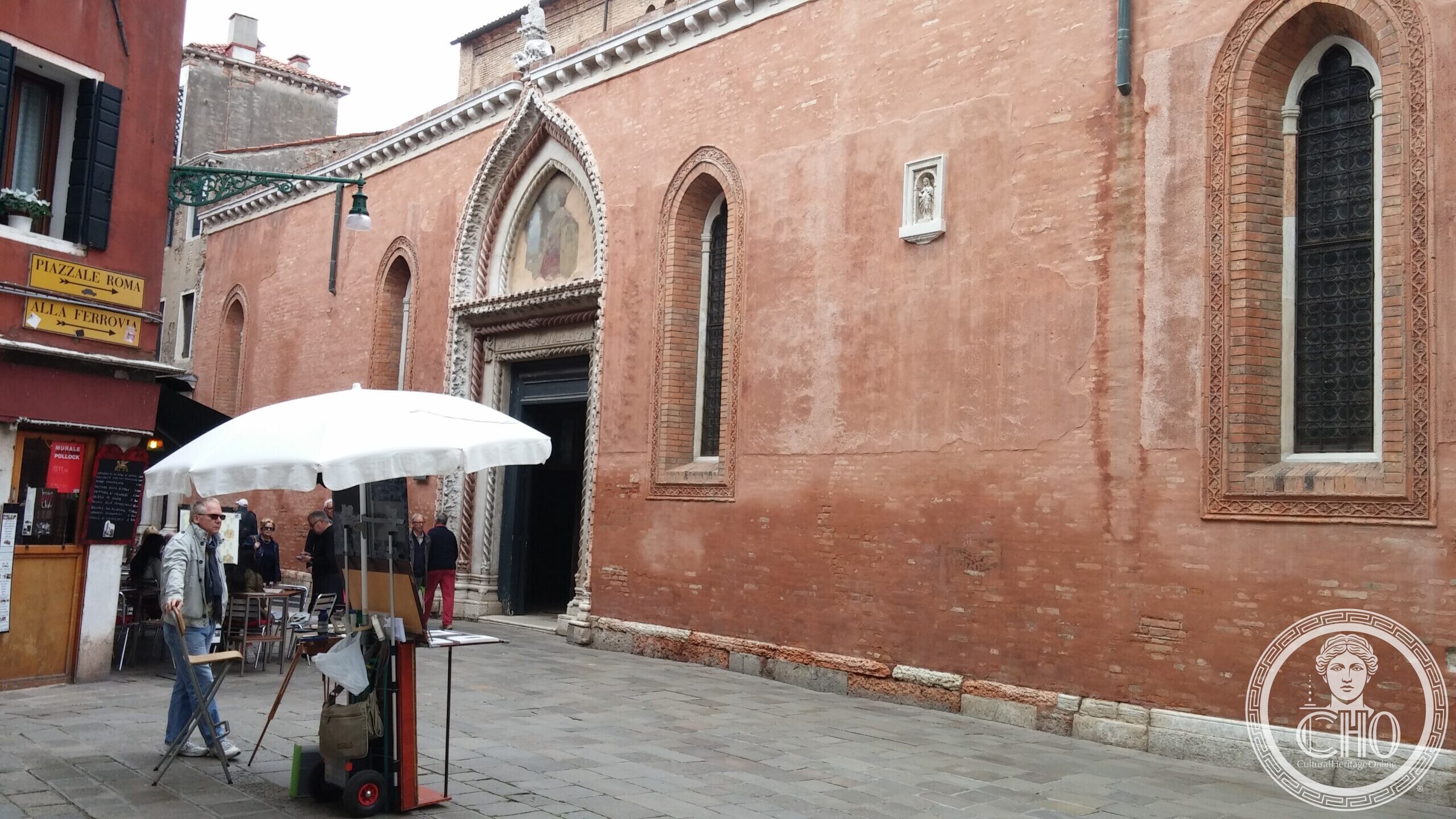 The Gothic side portal of the church of San Polo in Venice, with a painted lunette above the door