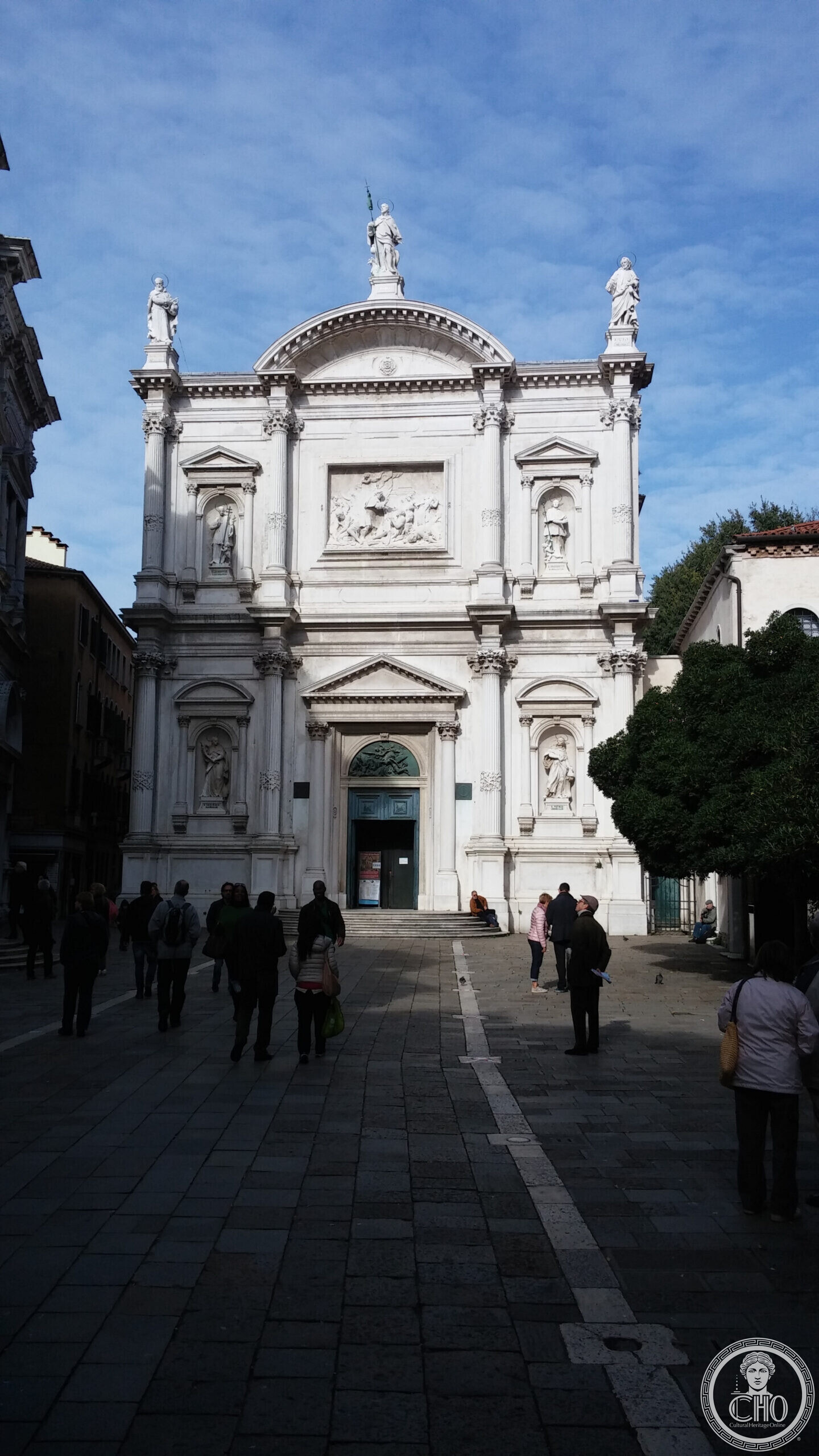 The city plaque on the church of San Rocco in Venice, listing the artists whose works it holds