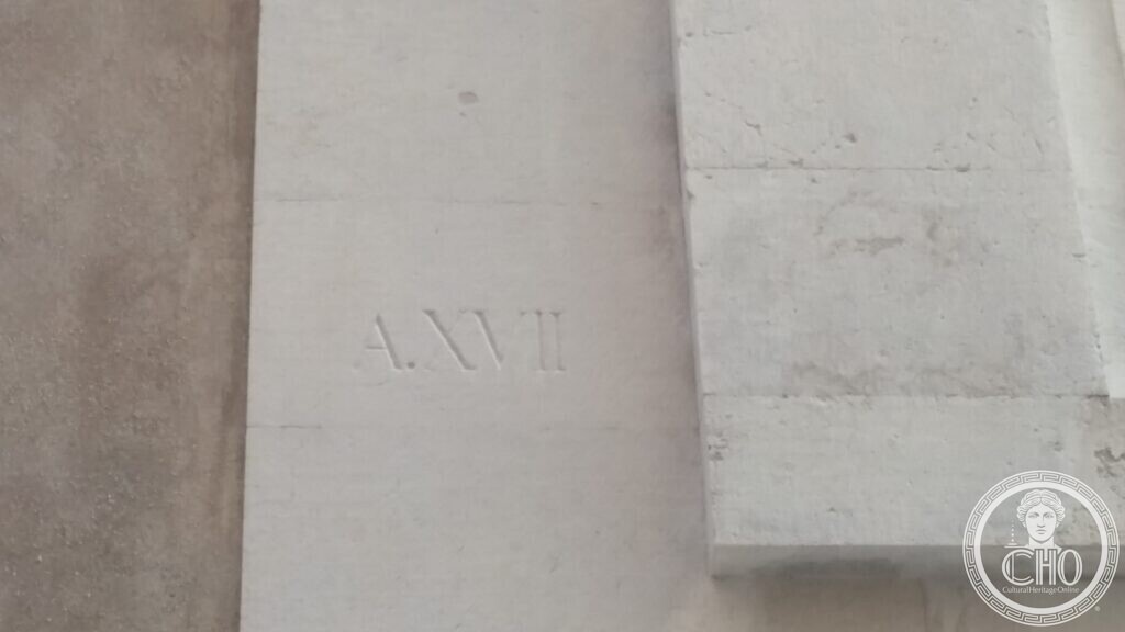 Stone panel carved with the Fascist-era date A.XVII (1938-39) on the facade of the former Cinema Teatro San Marco, Venice