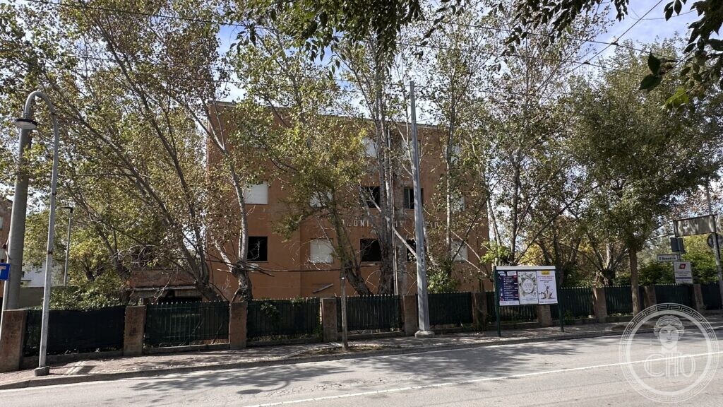 The building seen from Viale Gabriele D'Annunzio, with the street sign visible