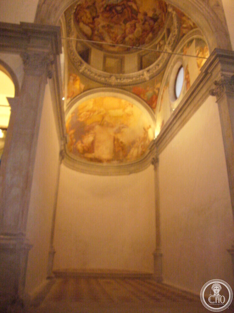 Upward view of the frescoed apse dome above the restored hall