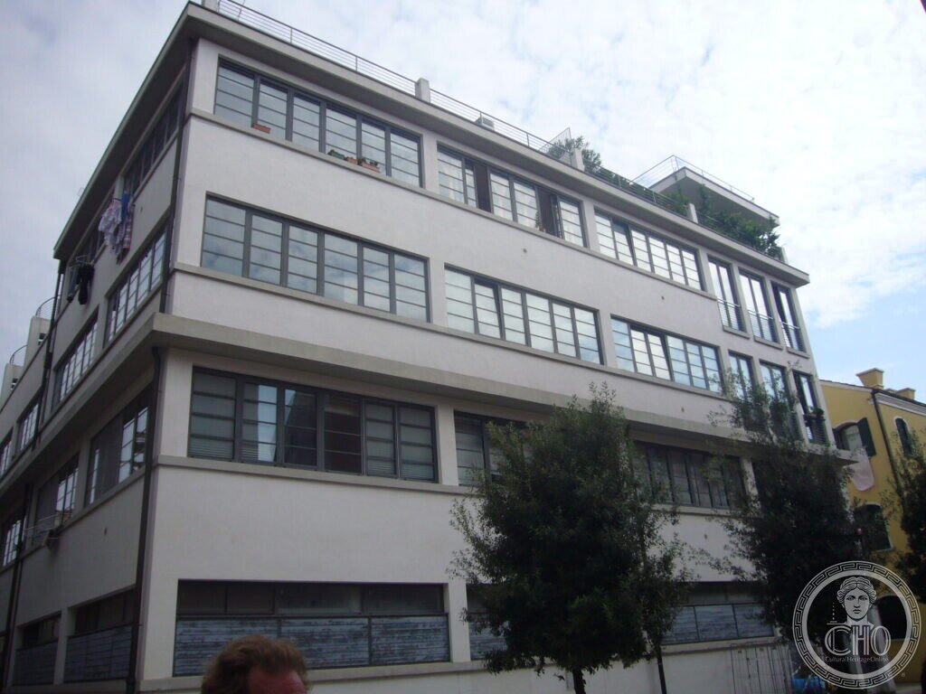 White former factory building of the Junghans complex with industrial ribbon windows, converted to housing