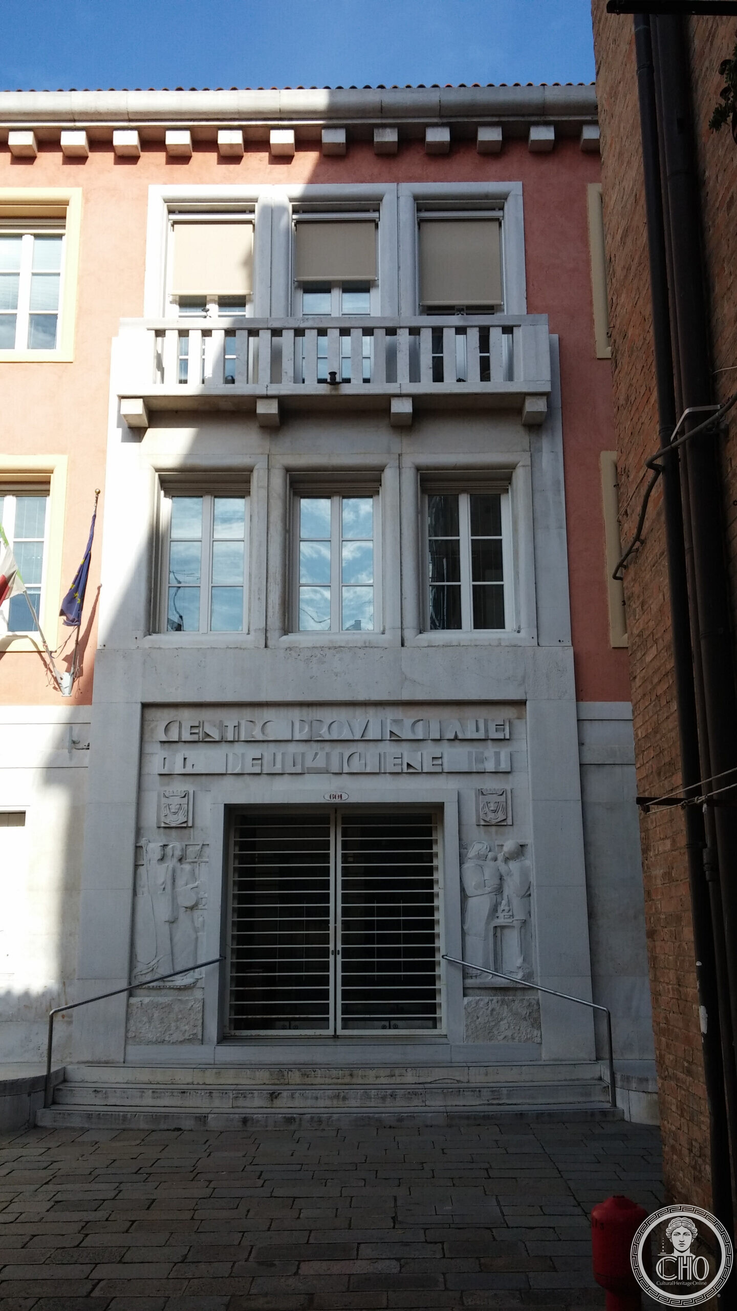 The stone entrance bay of the former provincial hygiene office at Campo de la Lana in Venice, with carved reliefs beside the door