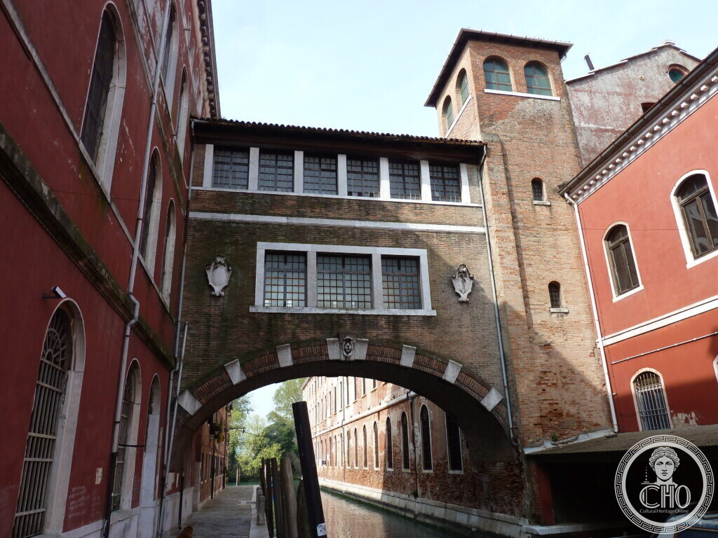 Bridge building connecting two wings of the former Manifattura Tabacchi tobacco factory over a canal in Venice