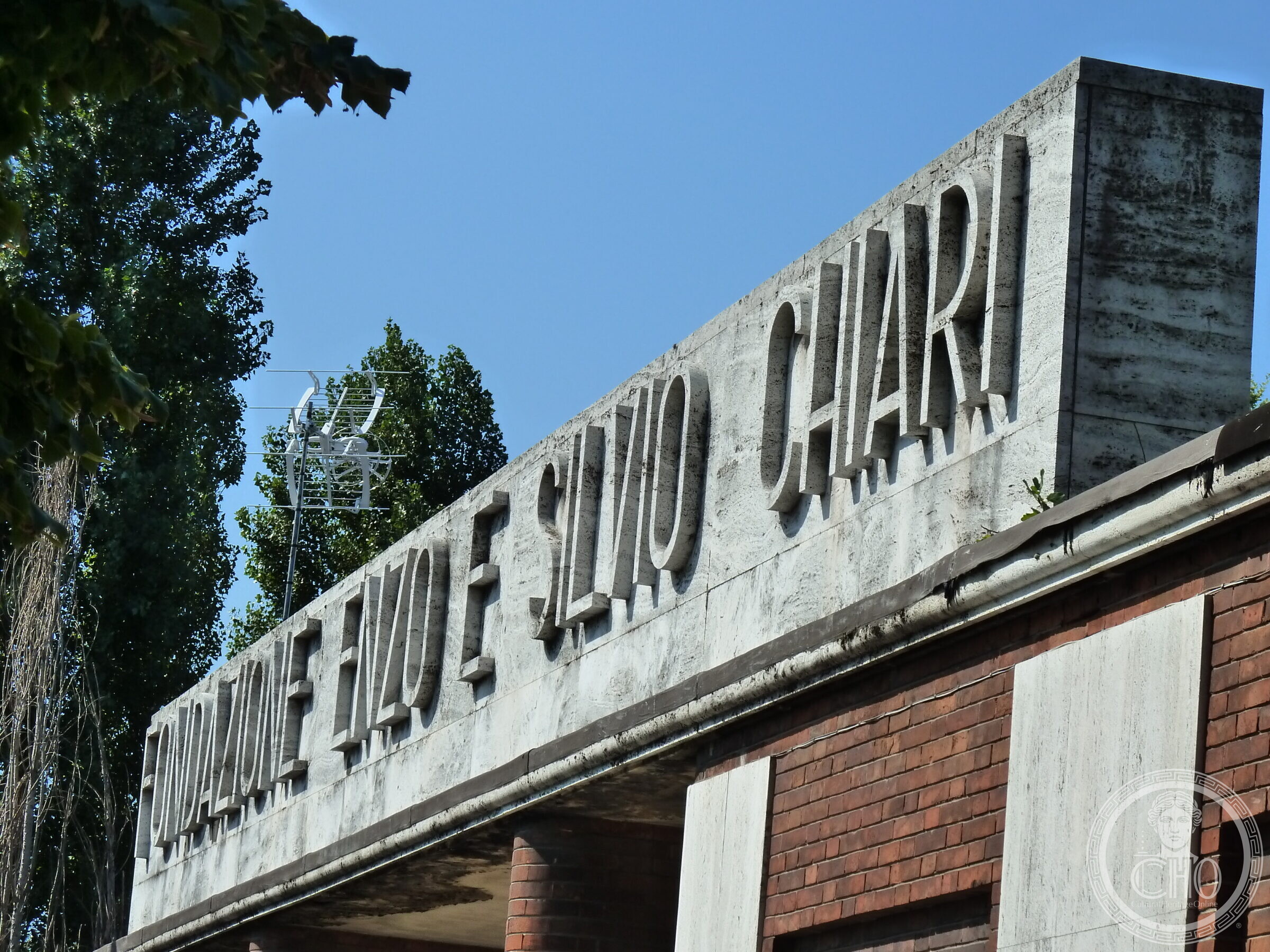 Raised stone lettering reading Fondazione Enzo e Silvio Chiari on the building's parapet
