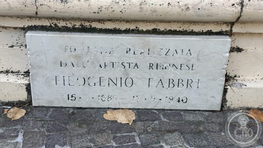 White marble tablet reading Fontana realizzata dall artista riminese Filogenio Fabbri 15-1-1880 17-9-1940