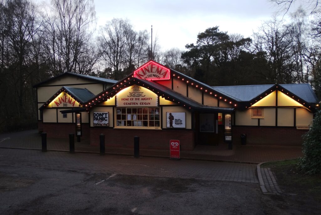 The Kinema in the Woods at Woodhall Spa, a low green building among pine trees
