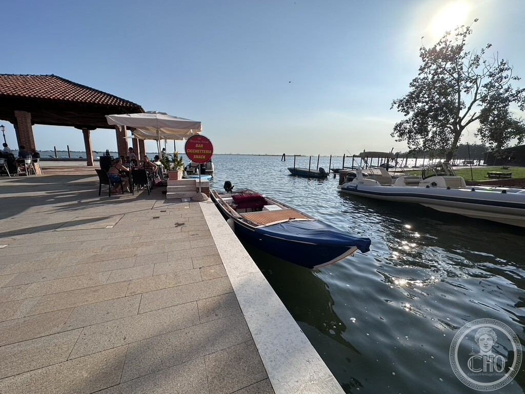 The former fish market of Burano, the Pescaria Vecia, on Burano's Fondamenta della Giudecca, with boats moored on the lagoon