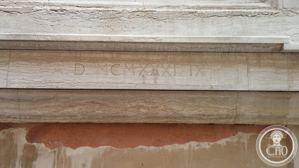 Close-up of the Roman-numeral dedication date A.D. MCMXXXI.IX carved on the base of the San Moisè war memorial plaque, Venice