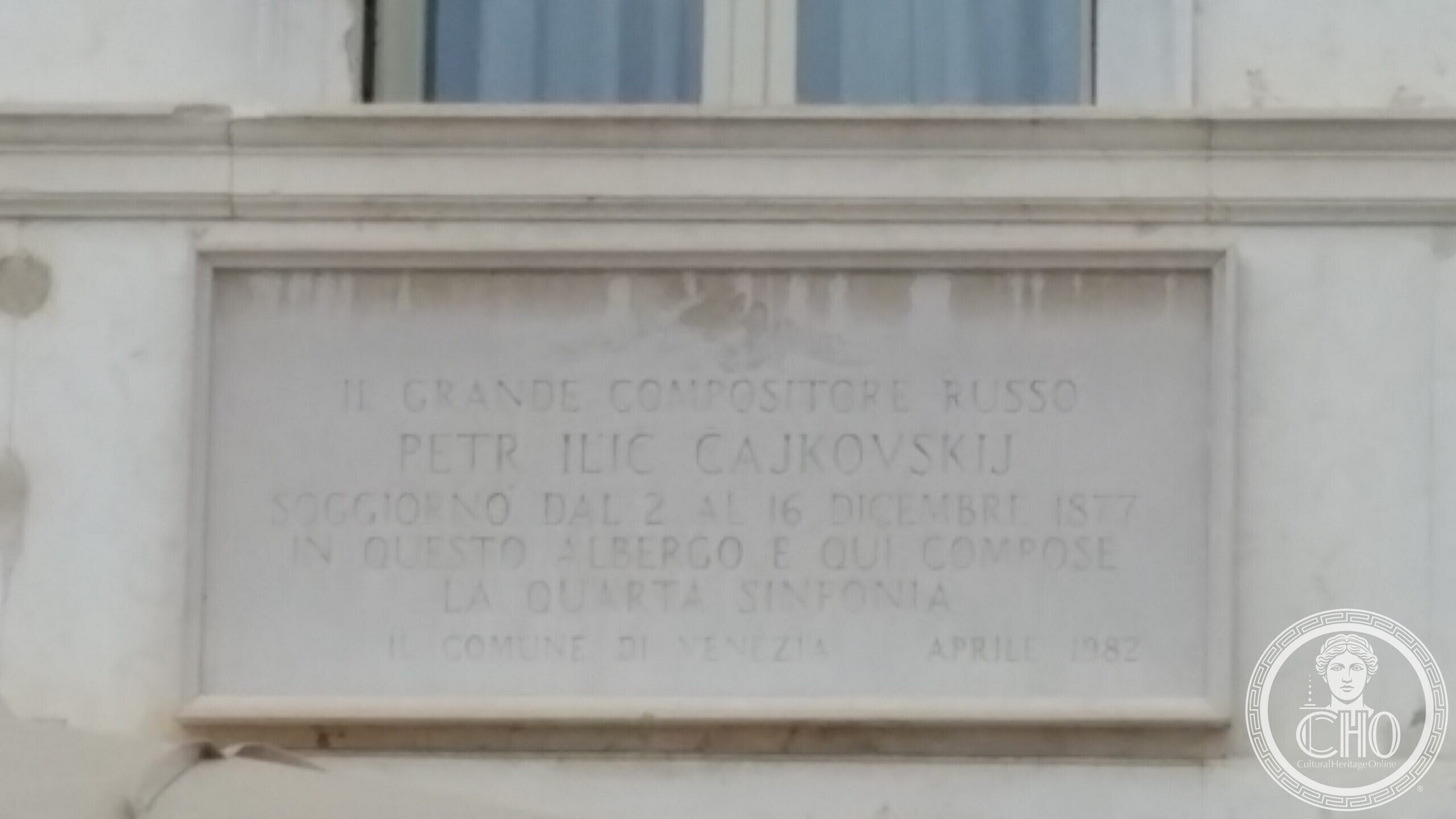 The Londra Palace in Venice with its name in raised letters, next to the equestrian monument to Victor Emmanuel II