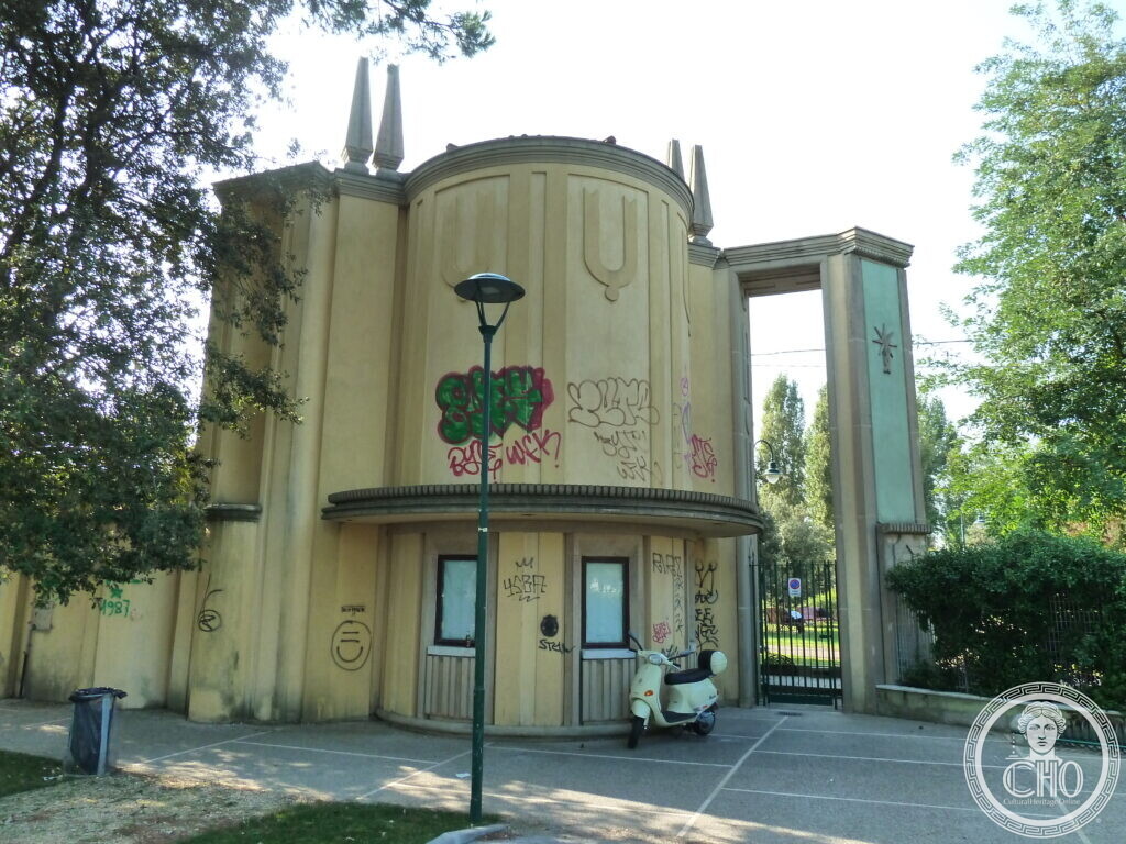 A round corner pavilion with pointed finials and a gated entrance, part of the former Luna Park complex