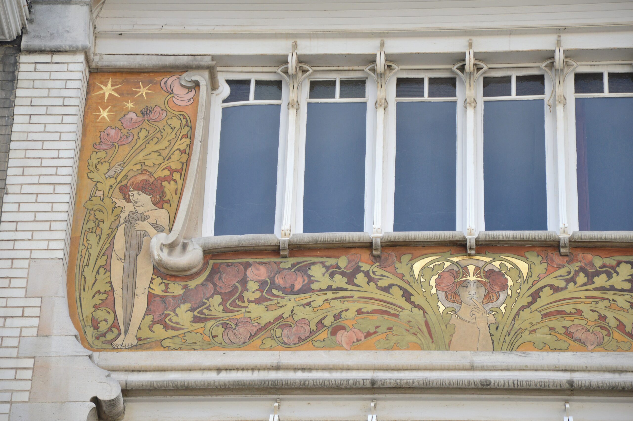 Art Nouveau sgraffito frieze with poppies, stars and a female figure holding a finger to her lips