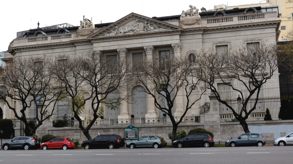 Stone facade of the Palacio Errázuriz on Avenida del Libertador, Buenos Aires, with giant Corinthian columns, a sculpted pediment and statue groups on the roofline