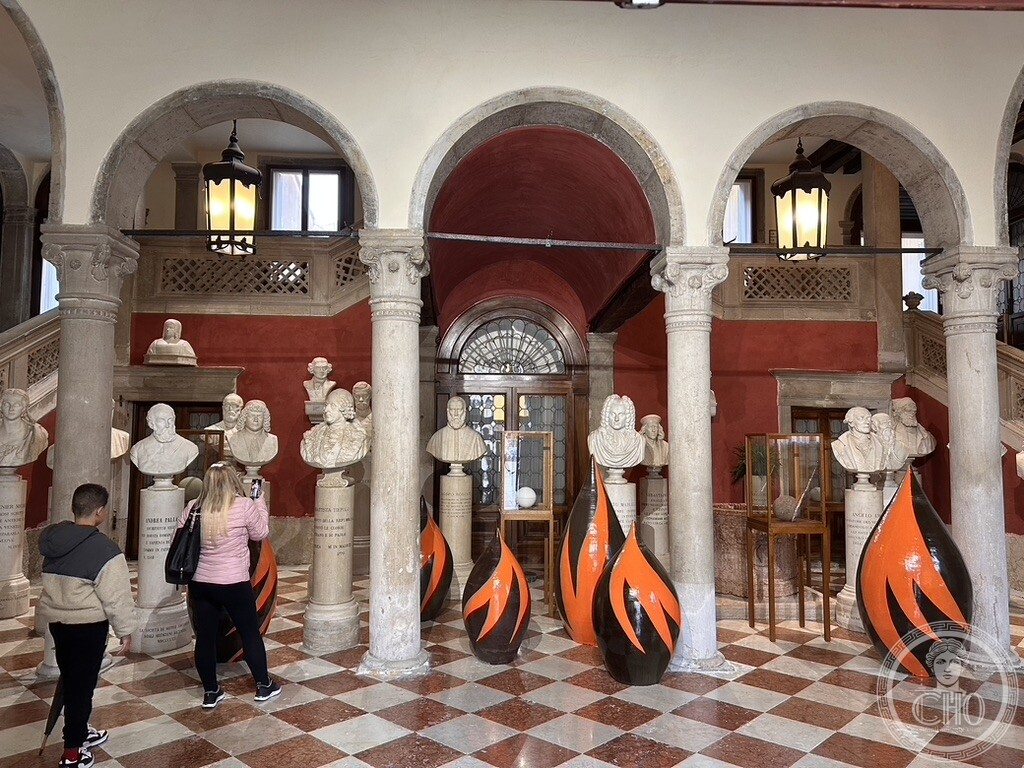 Atrium of Palazzo Loredan in Campo Santo Stefano with marble busts of the Panteon Veneto and contemporary Biennale ceramic installations