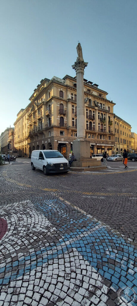 Palazzo Menato seen across piazza Garibaldi in Padua, with the column and the painted cobblestones in the foreground