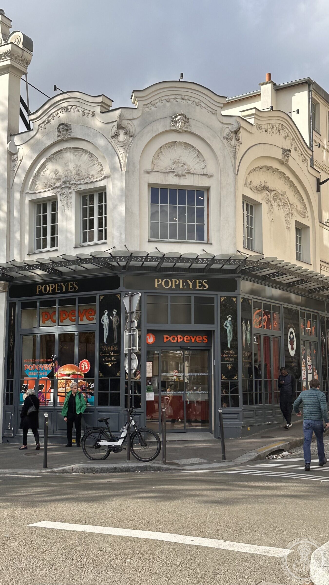 The Élysée Montmartre façade above the ground-floor shopfront on boulevard de Rochechouart