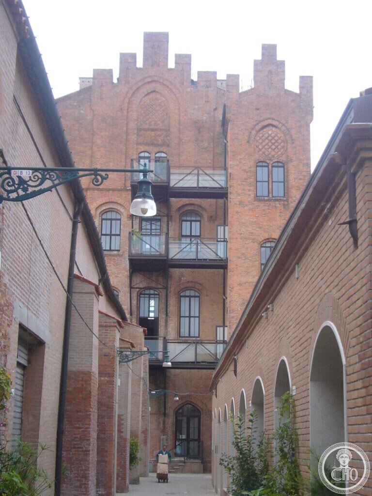 Neo-Gothic brick industrial buildings on the Giudecca converted to housing, with steel and glass balconies