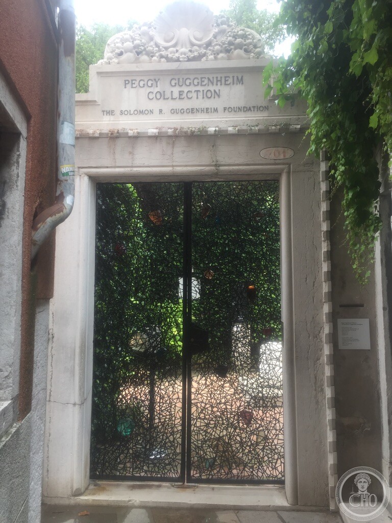Historic stone entrance portal of the Peggy Guggenheim Collection at Dorsoduro 701 with sculpted iron gate by Claire Falkenstein