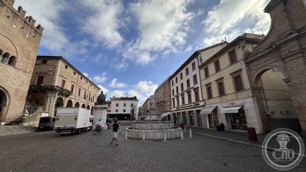 The Pigna fountain in the middle of Piazza Cavour with the statue of Paul V and the arcaded palaces behind