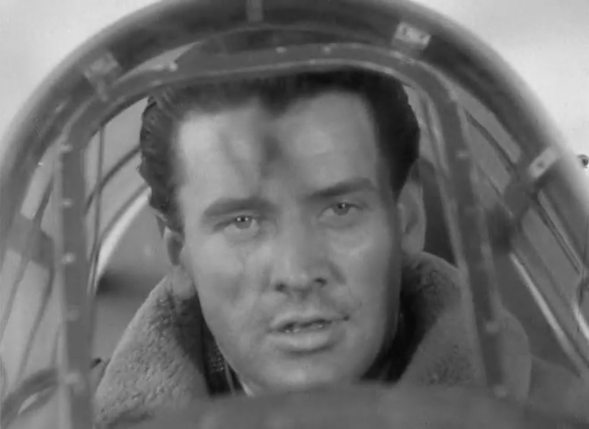 Massimo Girotti in an aircraft cockpit, a frame from the 1942 film Un pilota ritorna Massimo Girotti in an aircraft cockpit, a frame from the 1942 film Un pilota ritorna