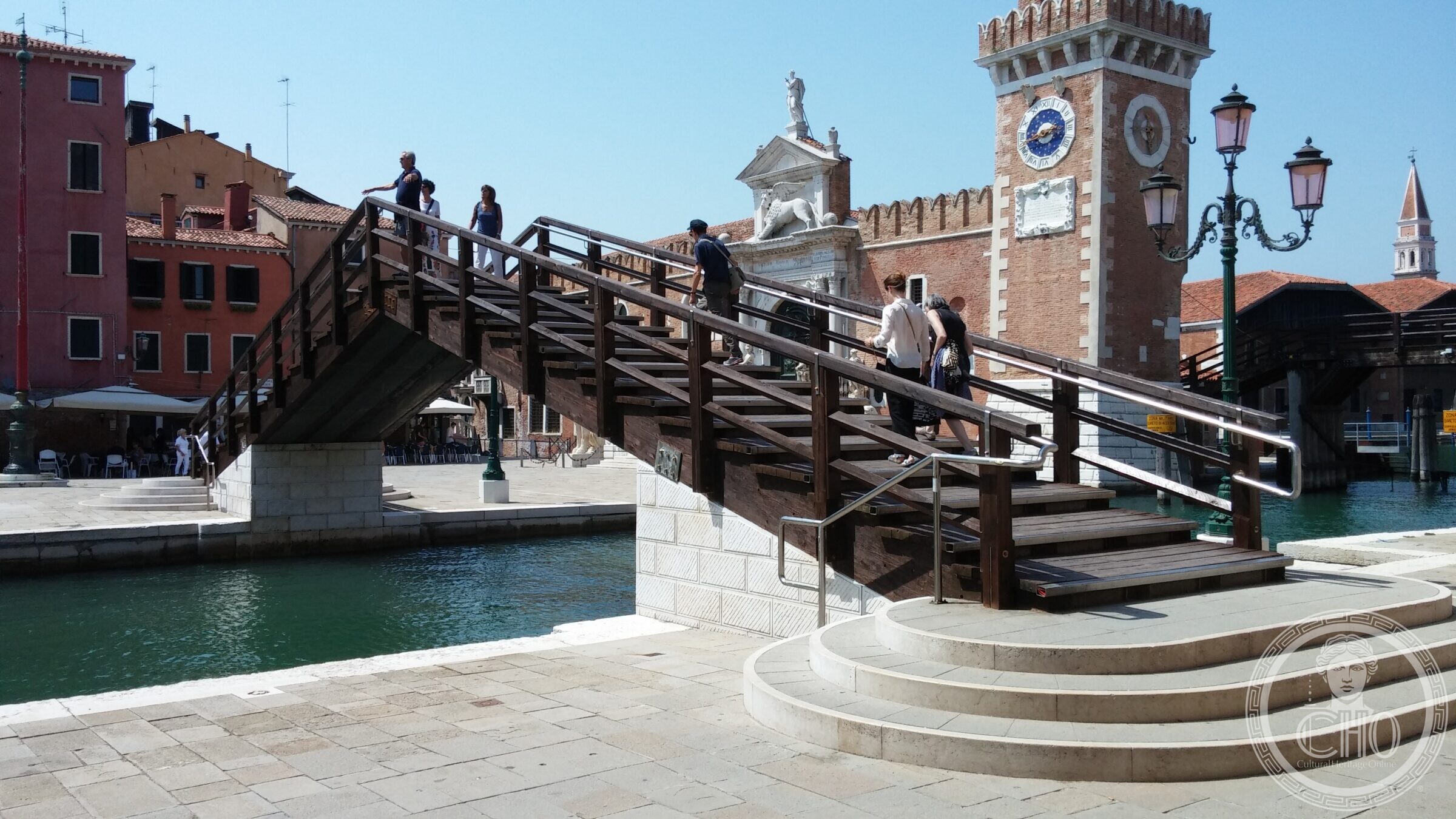 The timber deck and balustrade of the Arsenal bridge, with its stone abutment and curved steps