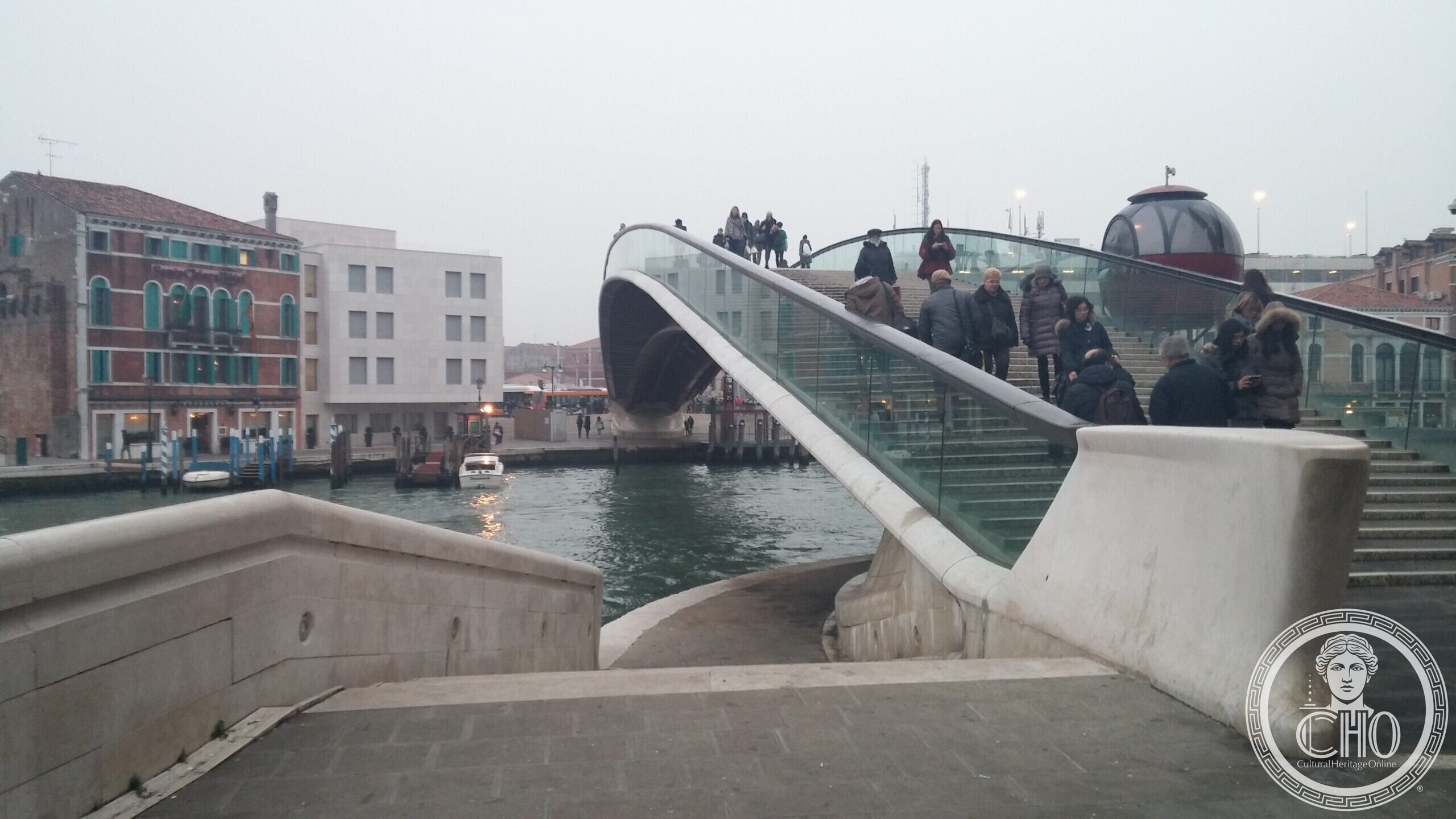 The red cabin of the accessibility lift on the Ponte della Costituzione in Venice, running on rails beside the deck