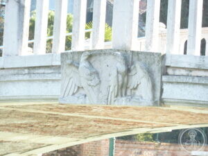 A worn relief on the far parapet