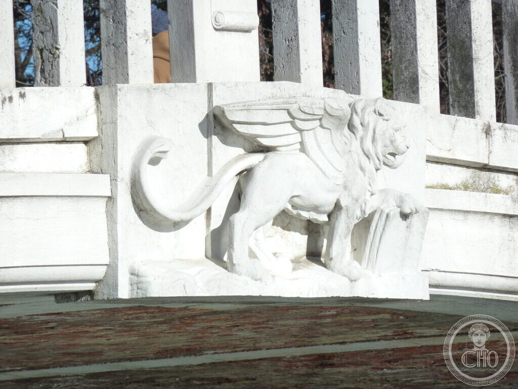 A carved relief of the winged lion of Saint Mark set into the stone parapet of the bridge
