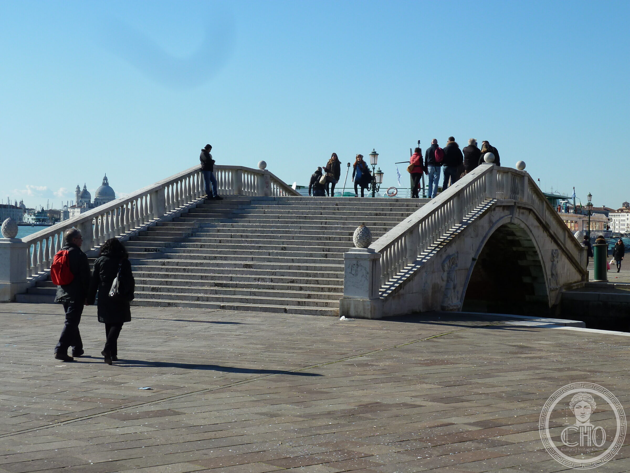 The wide shallow flight of steps of the Ponte de la Veneta Marina, with the dome of the Salute beyond