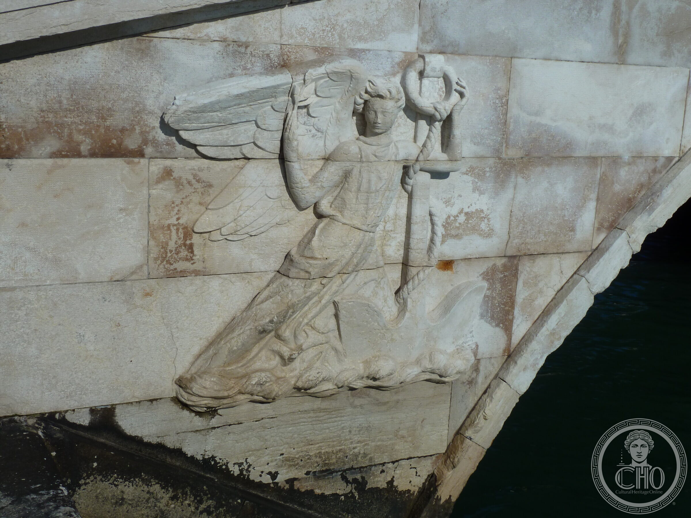 Carved winged Victory holding a staff with a wreath, on the spandrel of the Ponte de la Veneta Marina