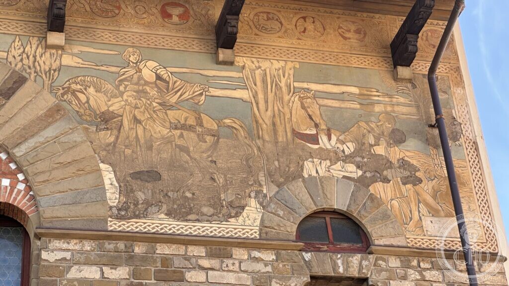 The stone and brick front of the Pubblica Assistenza building on via San Jacopo, Prato