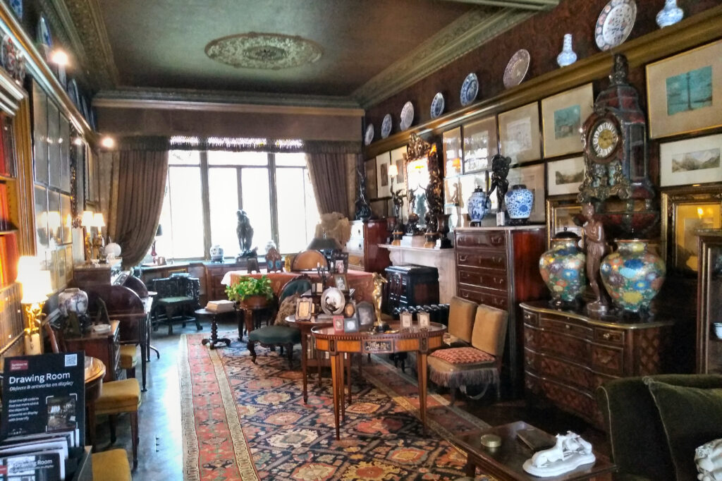 The drawing room at Sambourne House in Kensington, crowded with pictures, Morris wallpaper and blue-and-white china