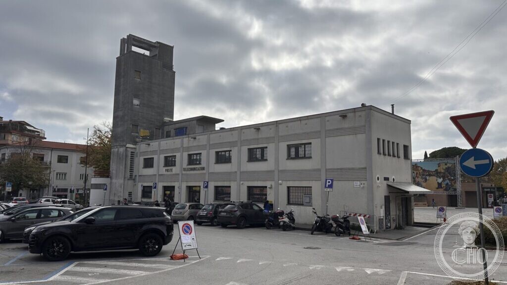 The Supercinema at Santarcangelo di Romagna seen from the car park side: the concrete tower and the long flank with its ribbon windows